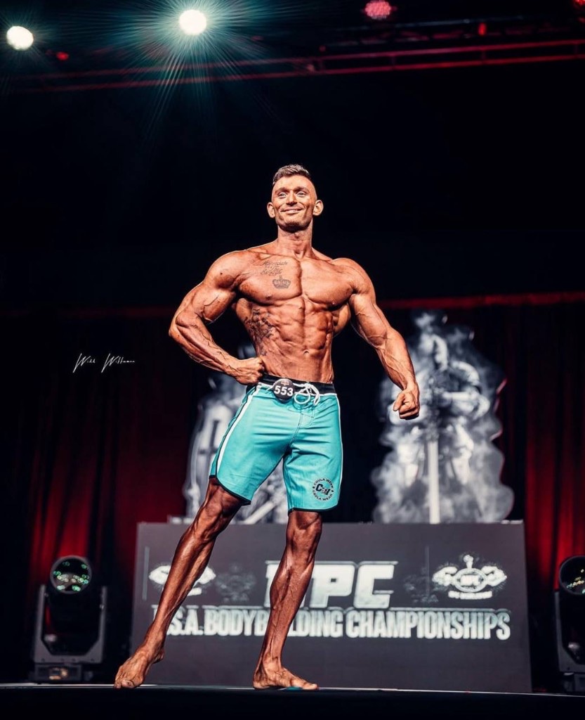 Nathan Linenberger on stage at NPC USA Bodybuilding Championships — Hemi Fitness coach @nate_the_hemi